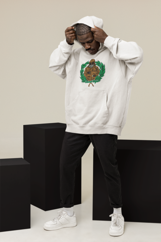 hoodie mockup featuring a man posing at a studio with colorful cubes m26650 1