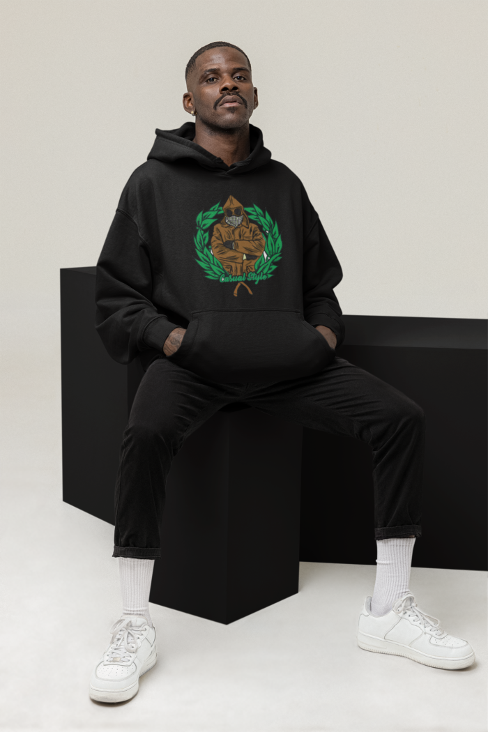 hoodie mockup of a serious man posing with some cubes at a studio m26162