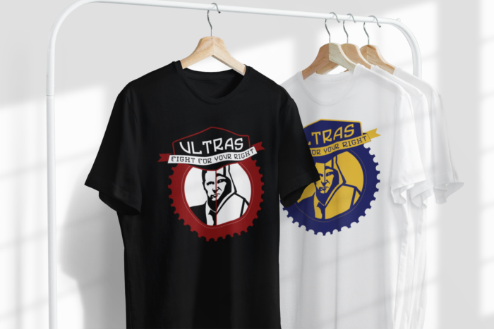 mockup featuring two customizable t shirts hanging from a metal clothing rack 3730 el1